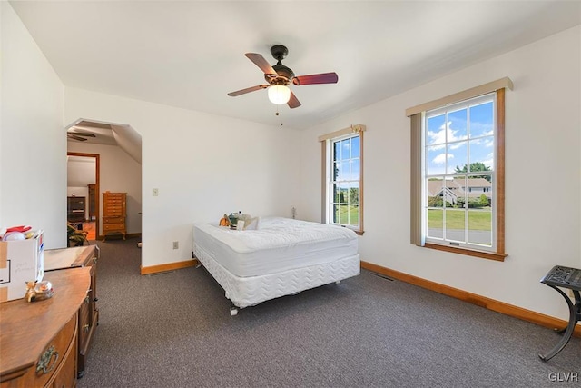 bedroom featuring ceiling fan and dark colored carpet