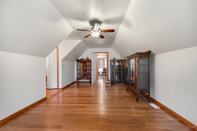 bonus room featuring vaulted ceiling, hardwood / wood-style floors, and ceiling fan