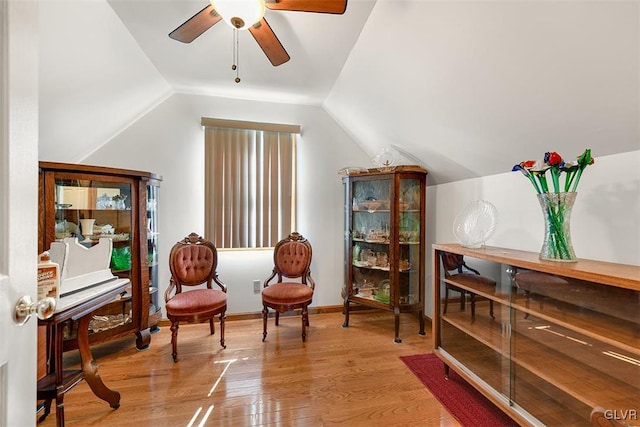 sitting room featuring lofted ceiling, ceiling fan, and light wood-type flooring