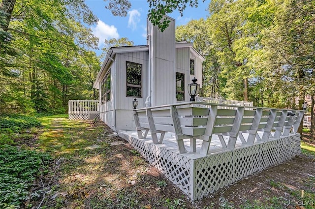 rear view of house with a wooden deck