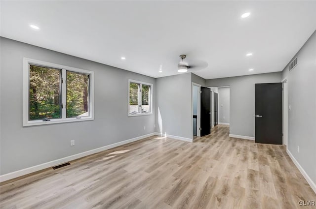 interior space with light wood-type flooring, plenty of natural light, and ceiling fan