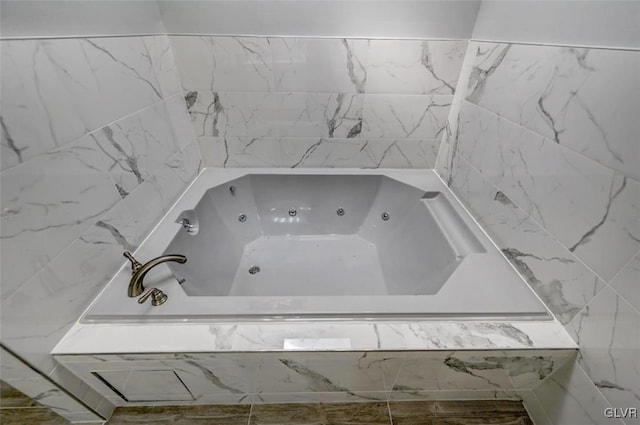 bathroom with tiled bath