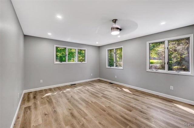 unfurnished room featuring ceiling fan and light hardwood / wood-style flooring