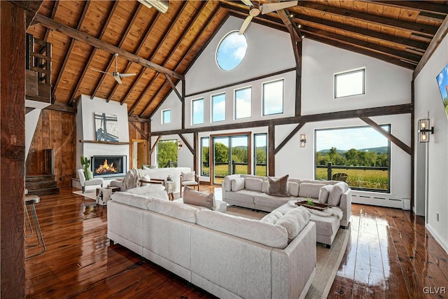 living room with dark wood-type flooring, high vaulted ceiling, a baseboard radiator, and ceiling fan