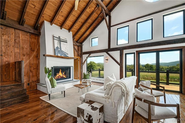 living room with wood ceiling, beamed ceiling, hardwood / wood-style flooring, and high vaulted ceiling