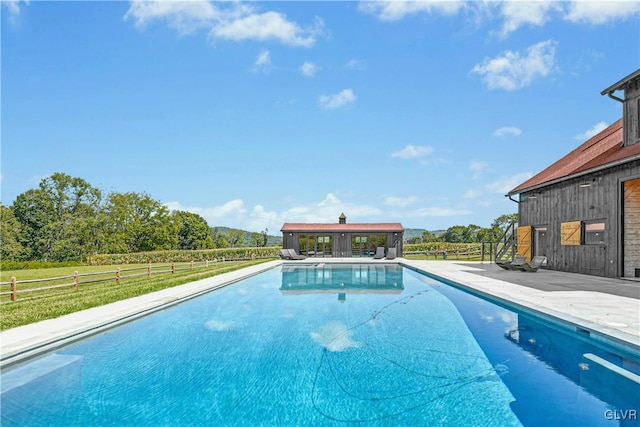 view of swimming pool featuring a patio area