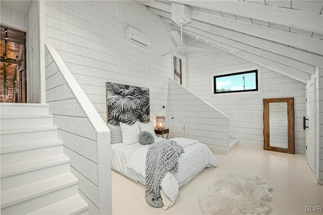 interior space featuring vaulted ceiling, a wall mounted air conditioner, concrete flooring, and wooden walls