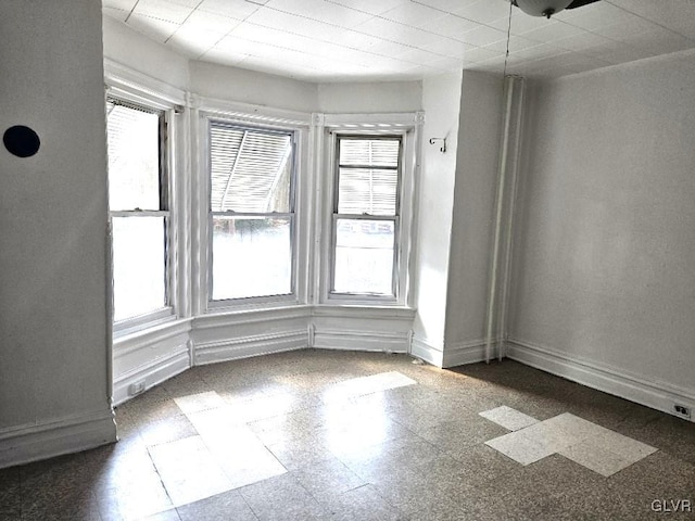 spare room featuring a wealth of natural light