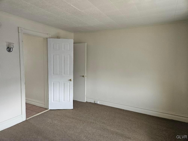 unfurnished room with light carpet