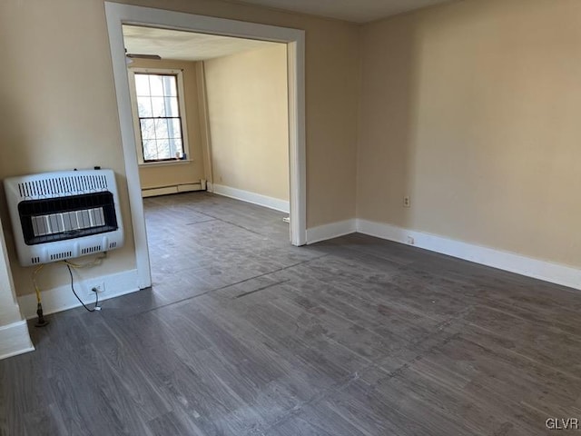 unfurnished living room featuring heating unit, a baseboard radiator, and dark hardwood / wood-style floors