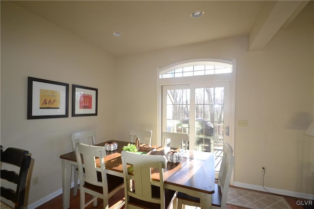 dining room featuring beamed ceiling