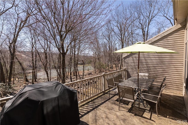 view of patio / terrace with area for grilling and a deck