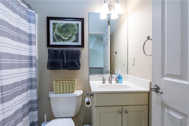 bathroom with walk in shower, vanity, and toilet