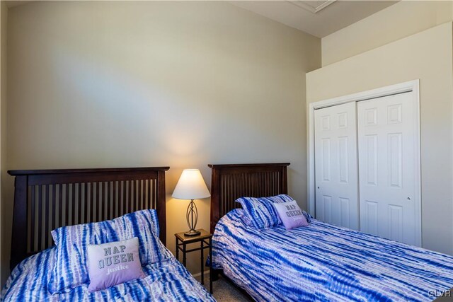 carpeted bedroom featuring a closet