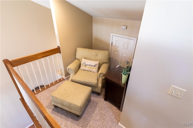 living area with vaulted ceiling and light carpet