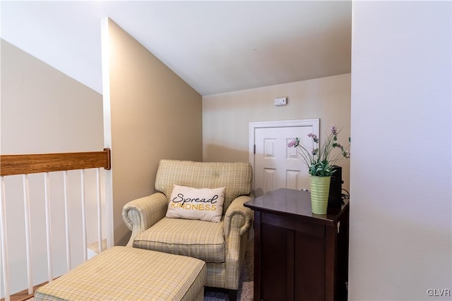 living area featuring vaulted ceiling