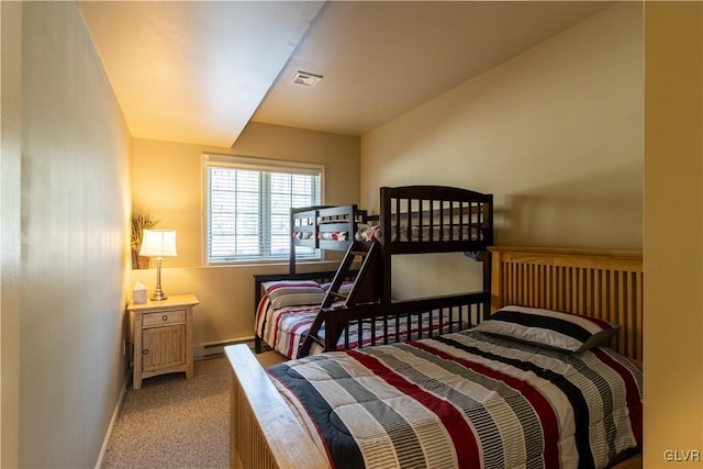 bedroom featuring a baseboard radiator and light colored carpet