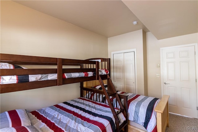 carpeted bedroom with a closet