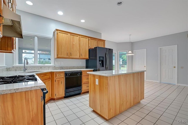 kitchen with sink, black appliances, light tile patterned floors, a kitchen island, and hanging light fixtures