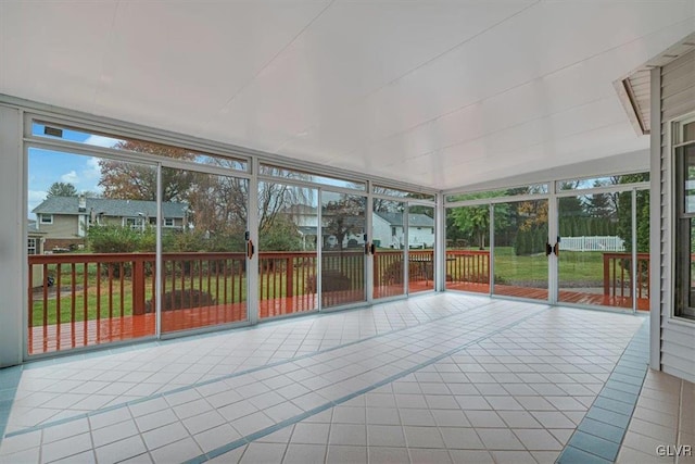 unfurnished sunroom with plenty of natural light