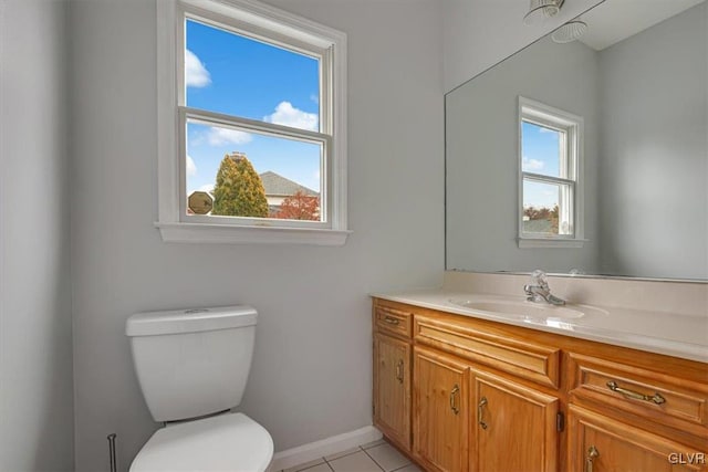 bathroom featuring tile patterned floors, vanity, and toilet