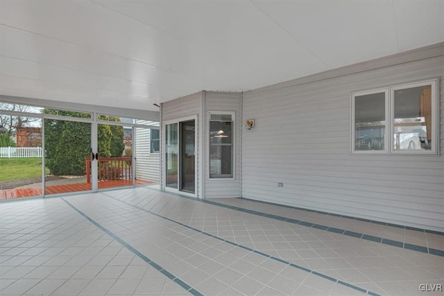 unfurnished sunroom featuring plenty of natural light