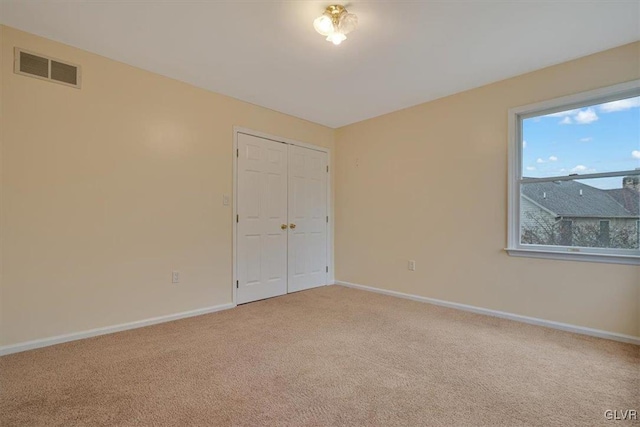 spare room featuring carpet floors