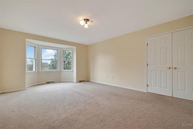 unfurnished room with carpet