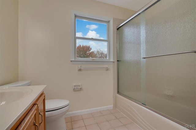 full bathroom with tile patterned flooring, vanity, toilet, and bath / shower combo with glass door