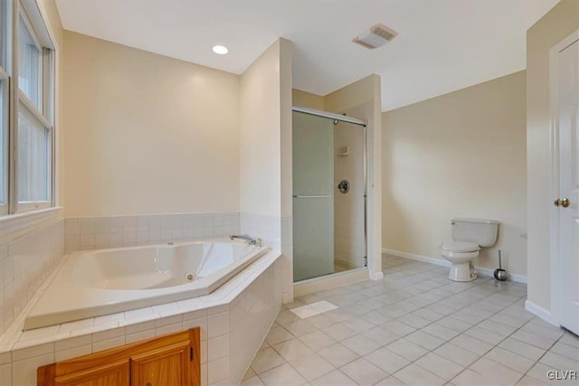 bathroom featuring tile patterned floors, toilet, and independent shower and bath