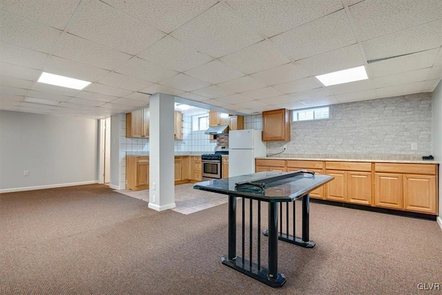 game room featuring a paneled ceiling, carpet, and a wealth of natural light