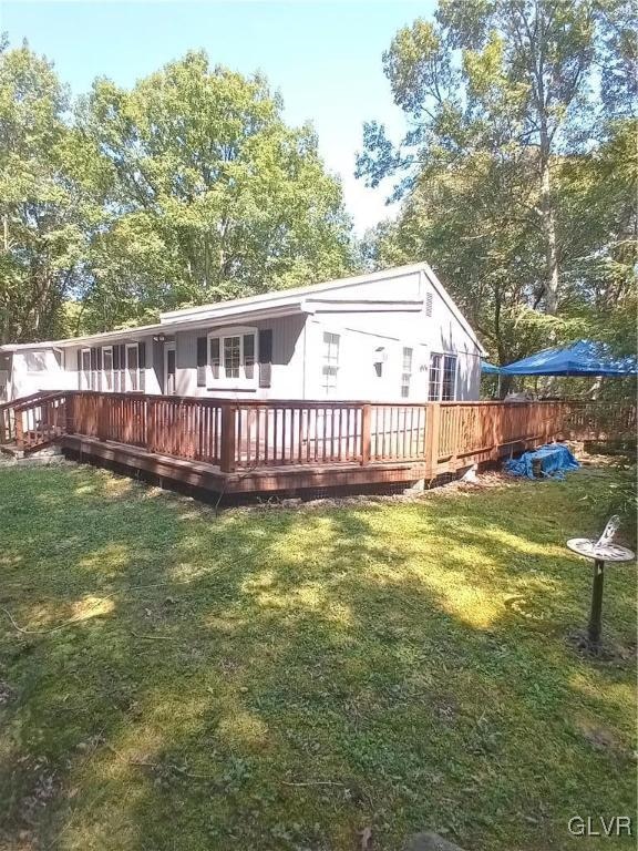 view of yard with a wooden deck