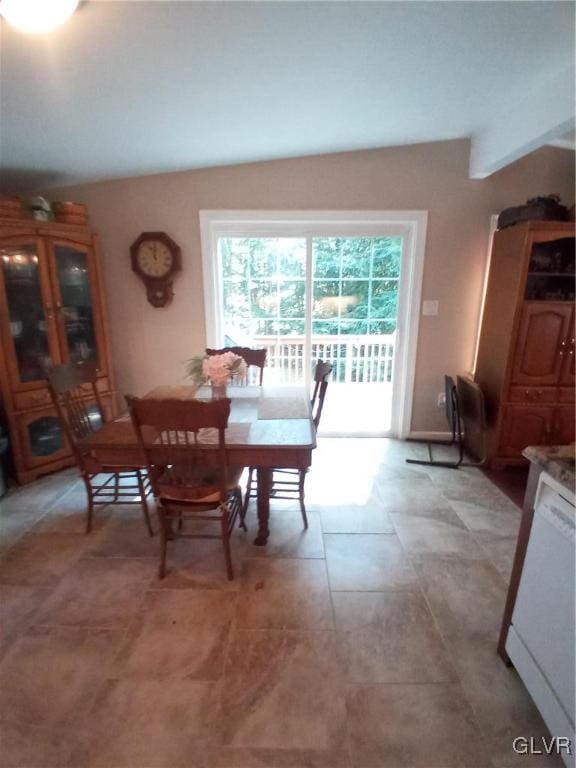 dining room with lofted ceiling