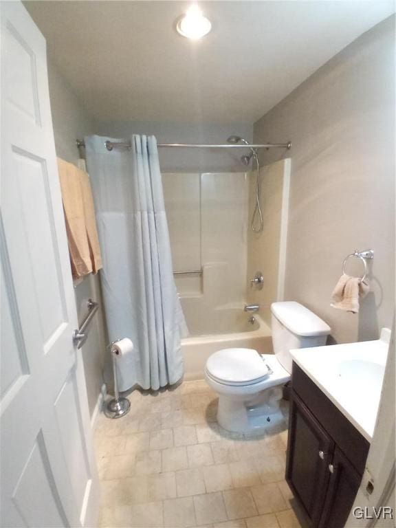 full bathroom featuring shower / bath combo with shower curtain, vanity, and toilet