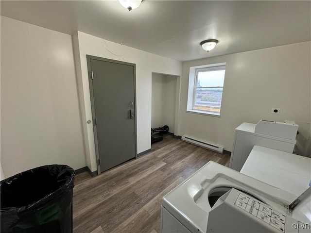 washroom featuring a baseboard radiator, dark hardwood / wood-style floors, and electric dryer hookup