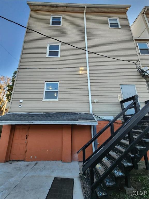 view of property exterior with a garage