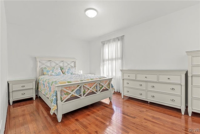 bedroom with wood-type flooring