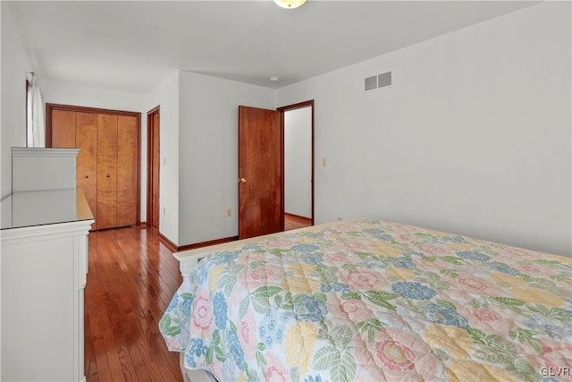 bedroom featuring a closet and light wood-type flooring