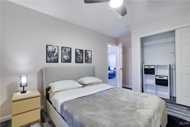 bedroom with dark wood-type flooring, a closet, and ceiling fan