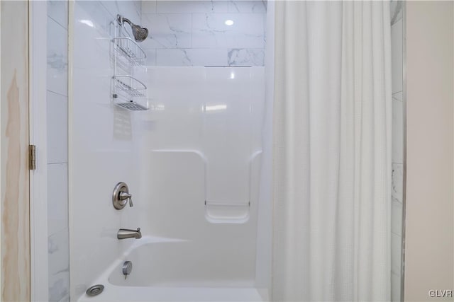 bathroom featuring shower / bathtub combination with curtain