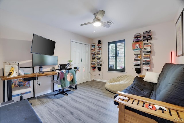 office area with ceiling fan and light hardwood / wood-style flooring