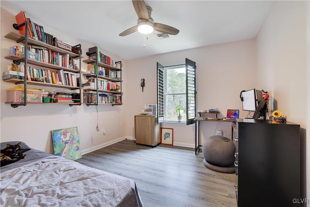 bedroom with hardwood / wood-style flooring and ceiling fan