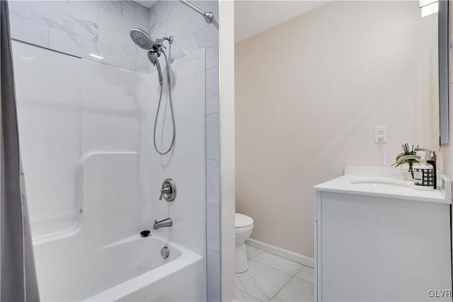 full bathroom featuring vanity, tiled shower / bath combo, and toilet