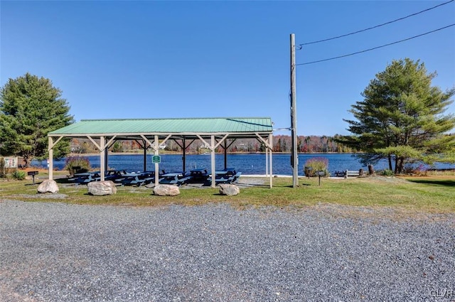 exterior space featuring a water view and a gazebo