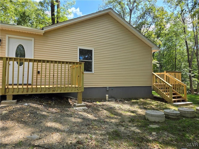 view of side of property featuring a deck