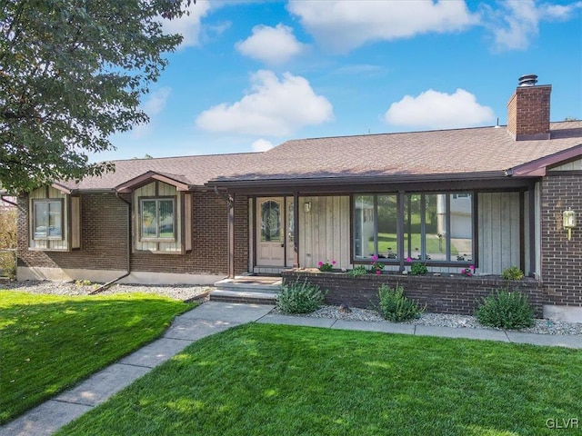 ranch-style home featuring a front yard