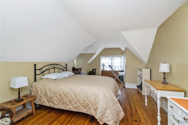 bedroom with lofted ceiling and dark hardwood / wood-style flooring