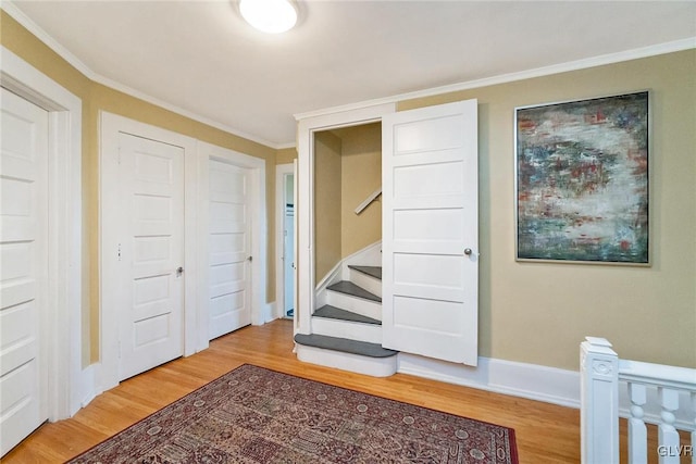 bedroom with wood-type flooring and crown molding