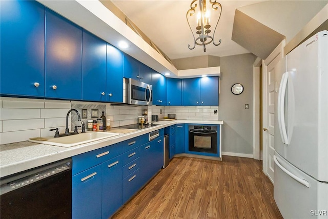 kitchen with dark wood-type flooring, a notable chandelier, black appliances, backsplash, and blue cabinets