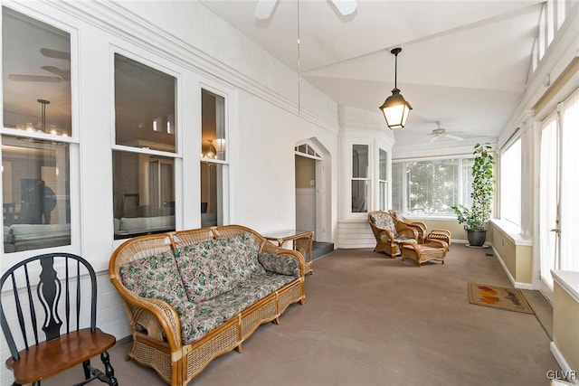 sunroom / solarium featuring ceiling fan and lofted ceiling